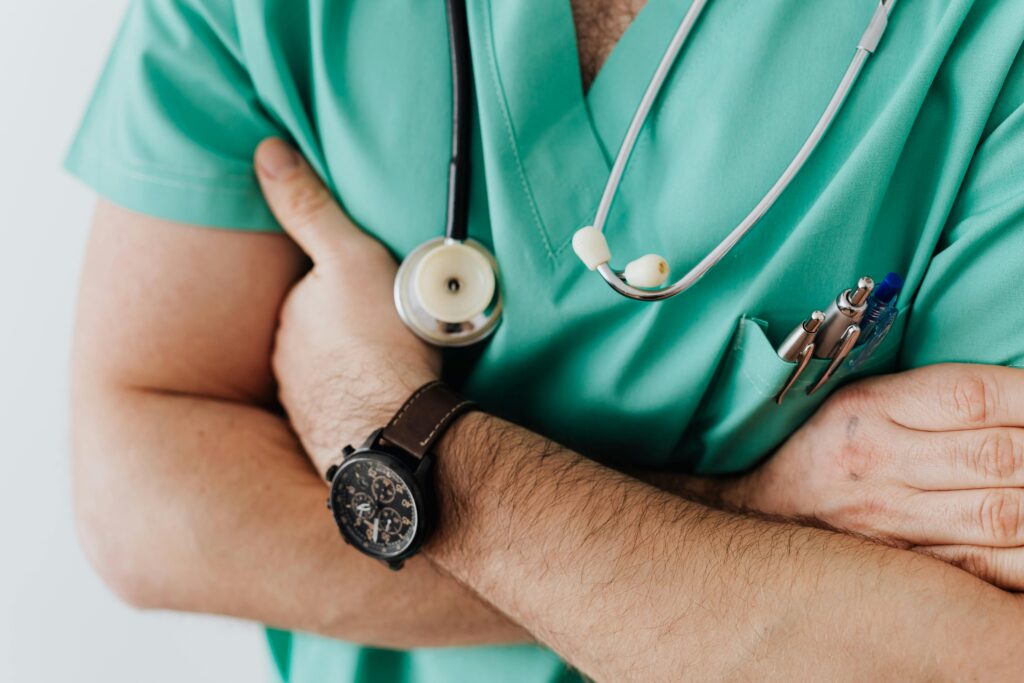 pexels photo 4021779 4021779 Doctor in scrubs with folded arms and stethoscope, symbolizing confidence in healthcare.